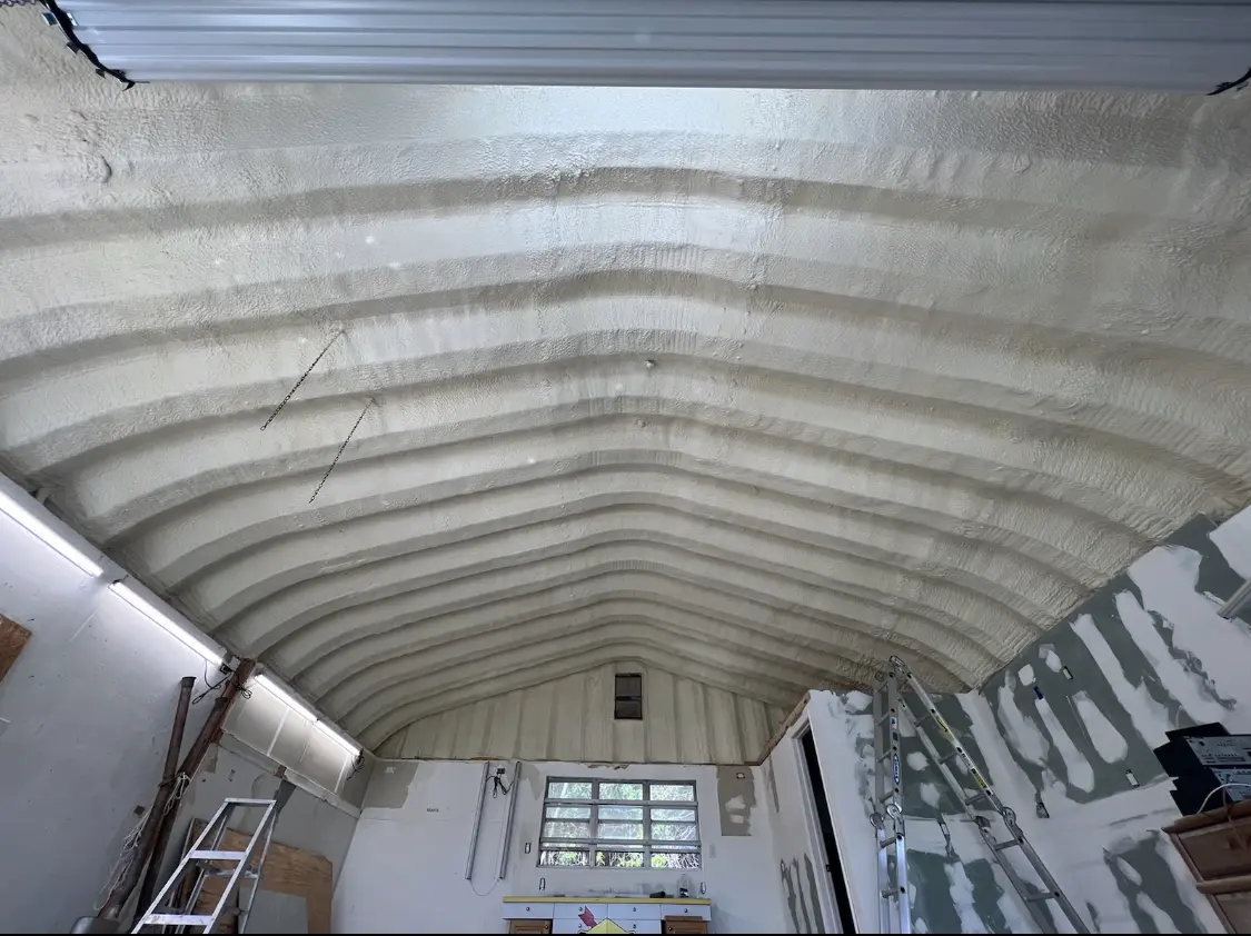 Spray polyurethane foam applied to the underside of a metal roof deck in Towson
